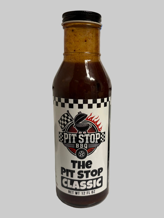 A 12 oz bottle of the pit stop classic bbq sauce.